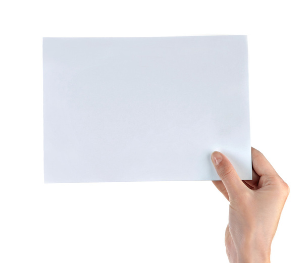 Female hand holding paper blank - Foto, Imagen
