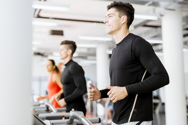 Group of people using treadmills - Фото, изображение
