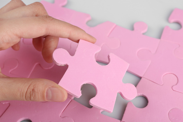 hand placing last piece of puzzle - Фото, изображение