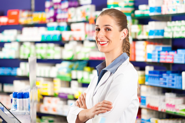 Female pharmacist in her pharmacy - Фото, зображення