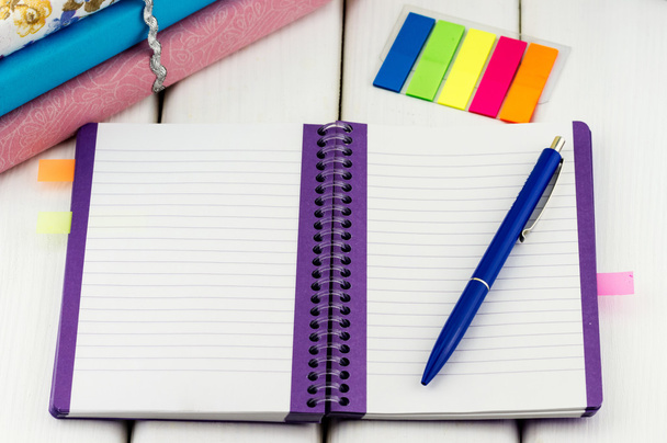 Notebook with pen and colorful stickers - 写真・画像