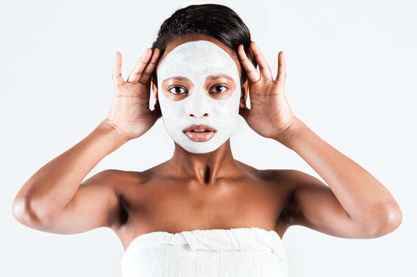 Beautiful African woman in Studio with facial mask - Fotó, kép