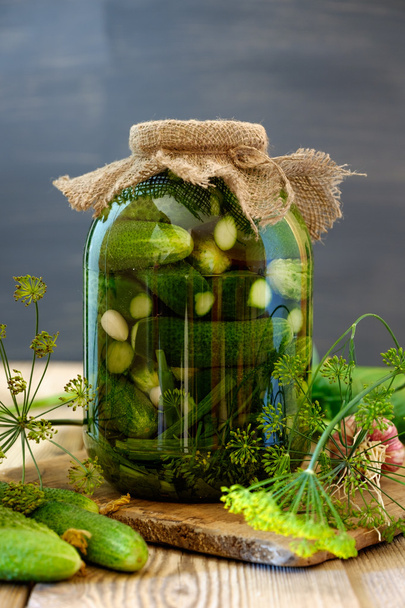 Jar of pickles on wooden table - Photo, Image