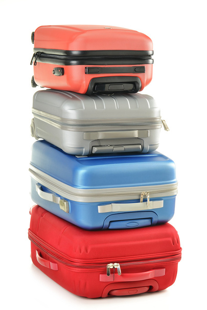 Luggage consisting of polycarbonate suitcases isolated on white - 写真・画像