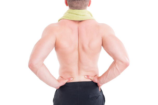 Спортивный человек держит поясничную область или нижнюю часть спины
 - Фото, изображение