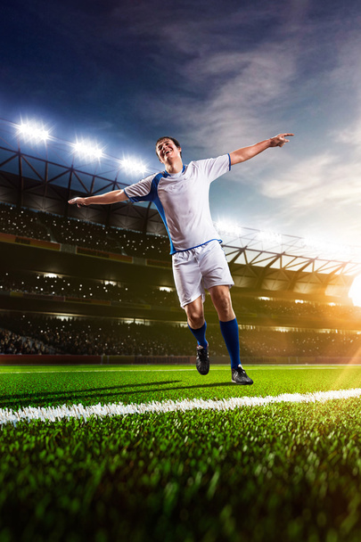 Soccer player in action panorama - 写真・画像