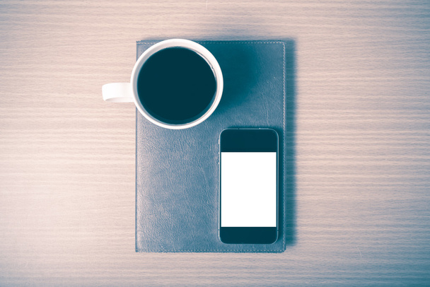 smart phone and coffee cup on book vintage style - Fotoğraf, Görsel