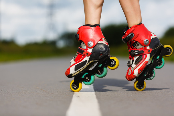 Legs of girl having roller skate exercise - Foto, Bild