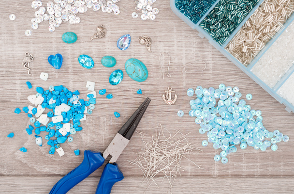 Crystals, pendants, charms, plier, glass hearts, box with beads  - 写真・画像