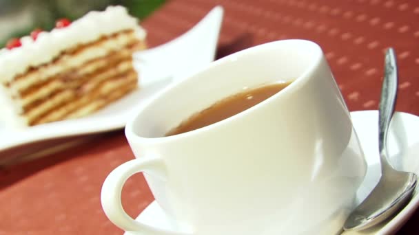 Tee auf dem Hintergrund von Kuchen - Filmmaterial, Video