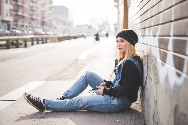 beautiful  woman with smartphone in city - Photo, Image