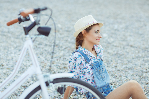 Beautiful woman with bicycle on the beach - Photo, Image