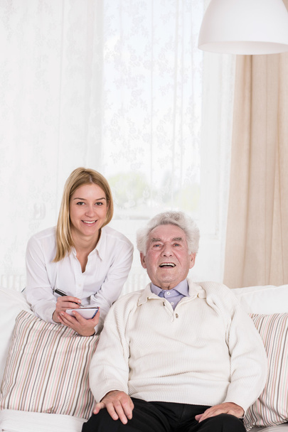 Female caregiver and senior man - Photo, Image