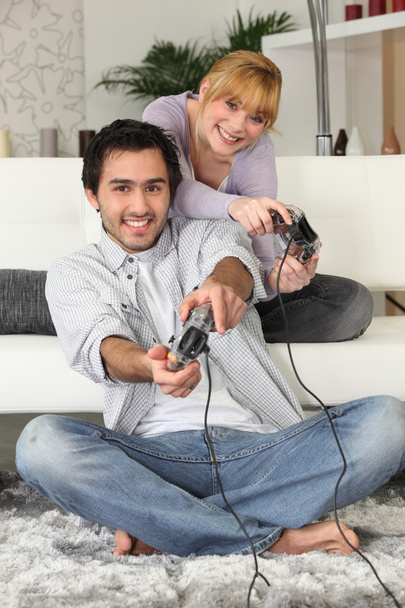Young couple playing video games - Foto, imagen
