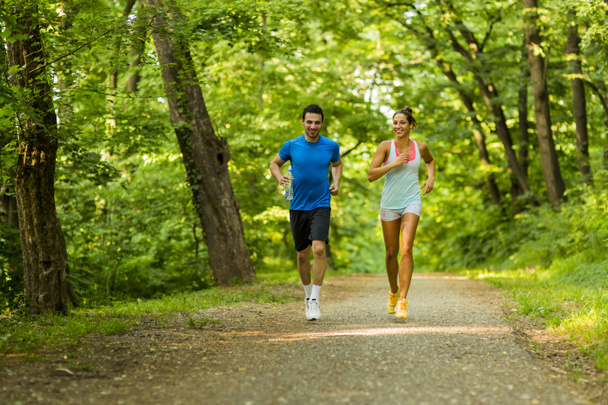 Young people jogging in nature - Photo, Image