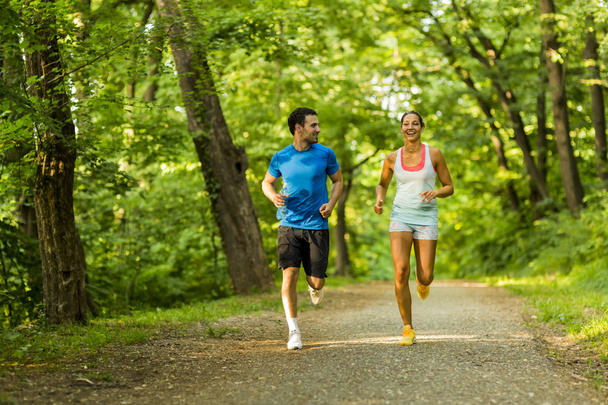 Young people jogging in nature - Foto, imagen