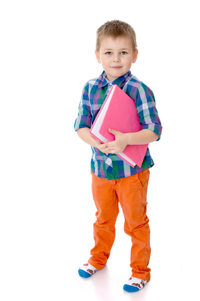 little boy holds his hands a book - Zdjęcie, obraz