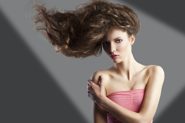 Pretty girl with great hair style, she has left hand on the righ - 写真・画像