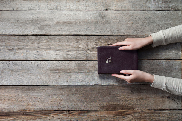 Woman hands on bible - Фото, изображение
