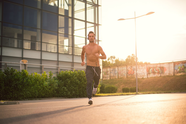 Young male jogging - Photo, Image