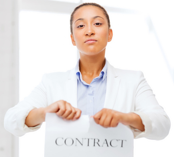 african businesswoman tearing contract - Фото, изображение