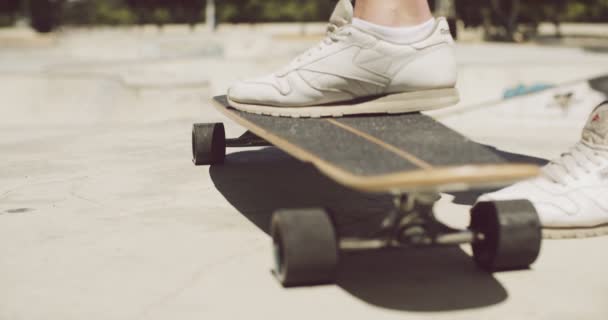Man standing with one foot on a skateboard - Footage, Video