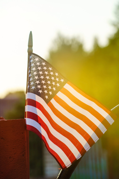 American flag in sunny weather outdoors - Fotó, kép