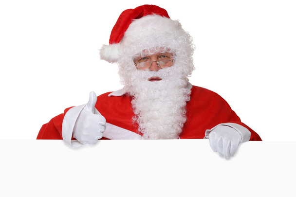 Santa Claus duimen opdagen op Kerstmis met lege banner en - Foto, afbeelding