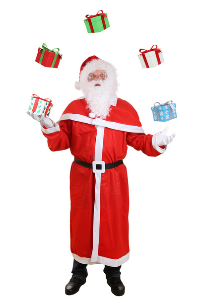 Santa Claus portrait throwing Christmas gifts isolated - Фото, изображение