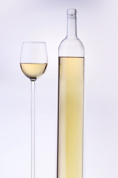 Stretched wine bottle and glass - Фото, изображение