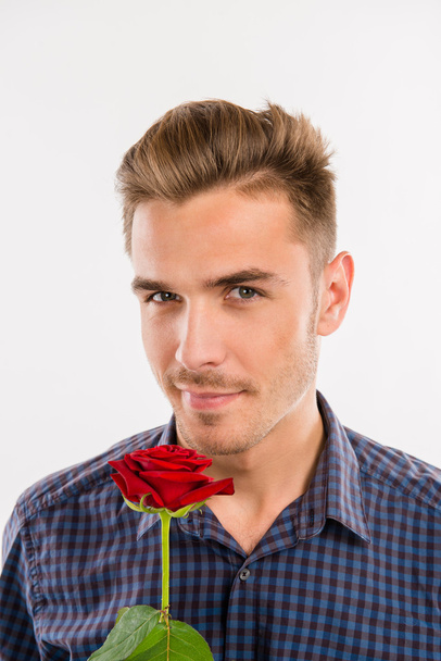 Romantic man gives a red rose - 写真・画像