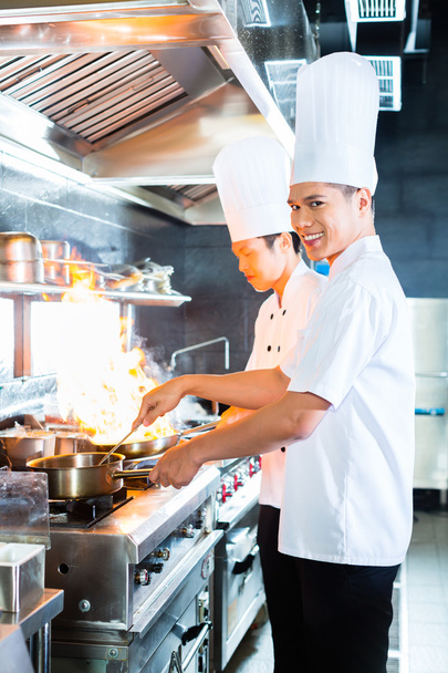 Asian chefs cooking in Restaurant - Foto, Bild