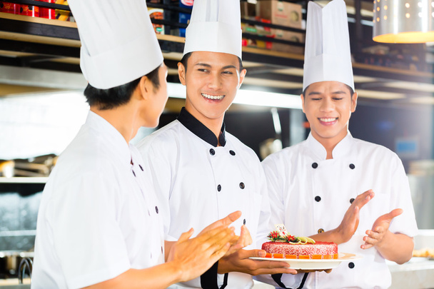 Asian chefs cooking in Restaurant - Photo, Image