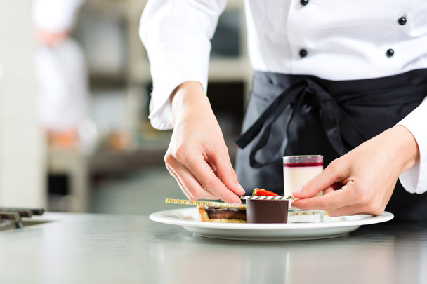 Cook, pastry chef, in hotel or restaurant kitchen - Photo, Image