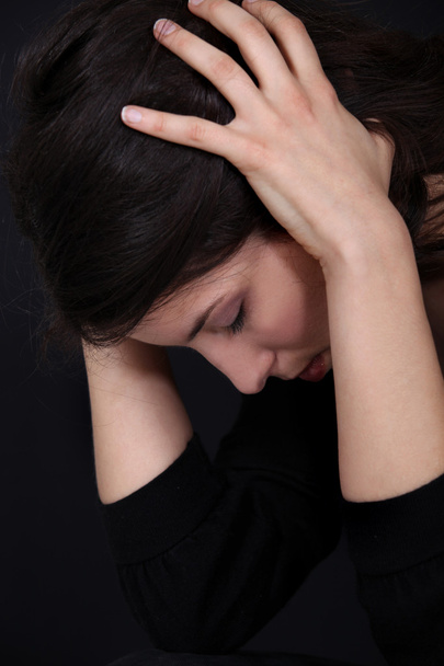 Woman holding head in pain - Φωτογραφία, εικόνα