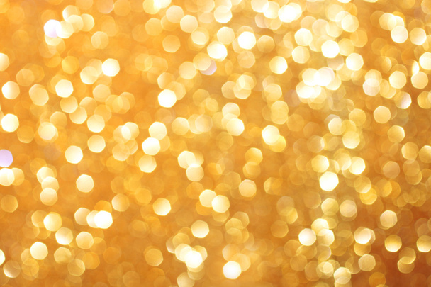 Gold glittering christmas lights. Blurred abstract background - Photo, image