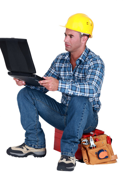 Distraught tradesman reading his emails - Foto, Imagem