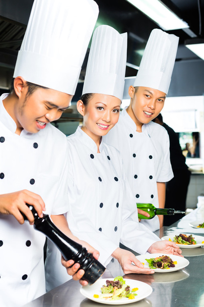 Asian Chef in restaurant kitchen cooking - Photo, Image