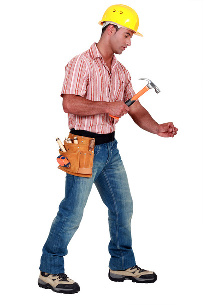 Tradesman using a hammer - Photo, Image