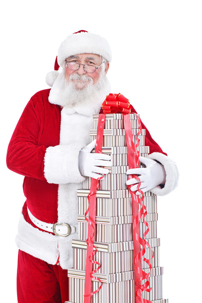 Santa hugging big gift boxes - 写真・画像