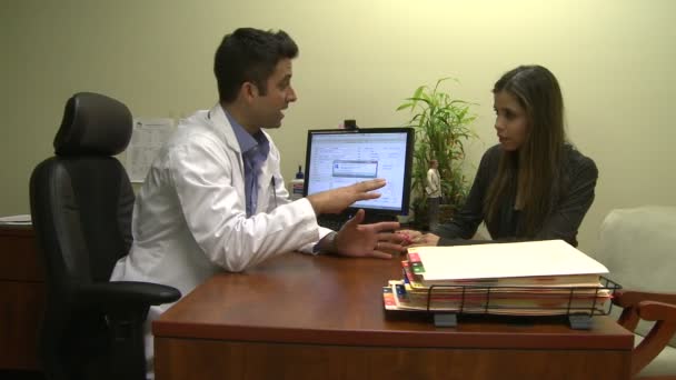 Doctor consulting with a patient about a life threatening diagnosis - Metraje, vídeo