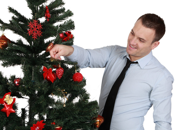 Man decorating the Christmas tree - Foto, Bild