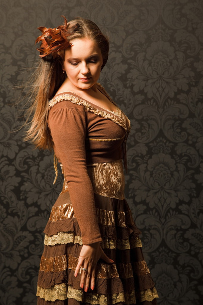 Woman in a brown dress - Foto, Imagen