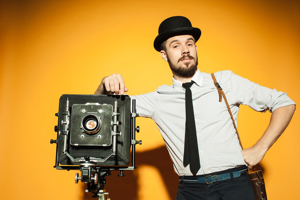 young man with retro camera  - Fotografie, Obrázek