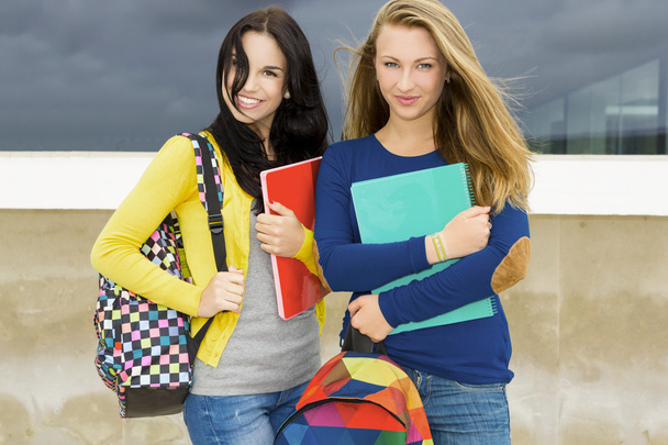 teenage students holding backpacks and smiling - Photo, image