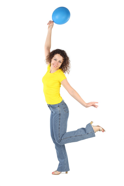 Young attractive woman in yellow shirt and jeans with blue ballo - Foto, Imagem