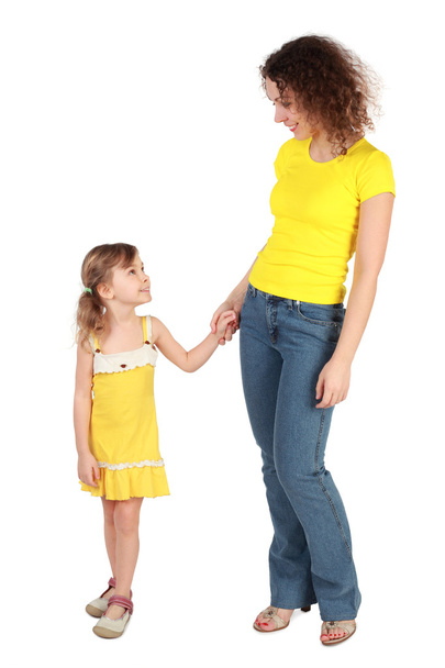 Mother and daughter holding for hands looking to each other and - Foto, Imagem