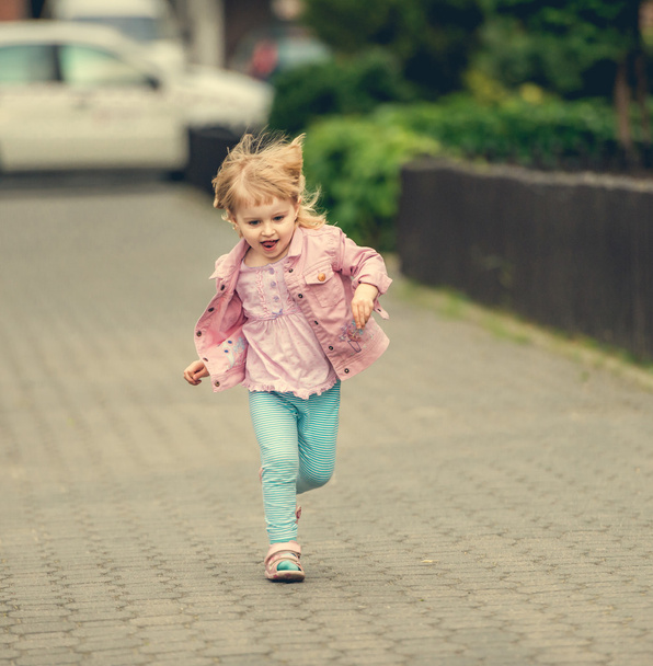 little cute girl running  - Foto, Bild