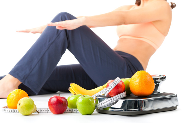女性が腹筋をやっているダイエットとスポーツ- - 写真・画像