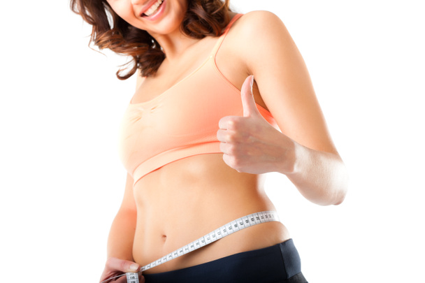 ダイエット - 若い女性は彼女の腰を測定します。 - 写真・画像